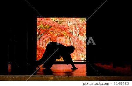 A monk and autumn leaves 5149483