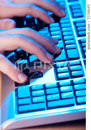 Two hands working on the silver keyboard Two hands working on the silver keyboard 5156645