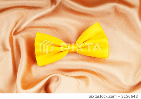 Bow ties on the bright satin background Bow ties on the bright satin background 5156648