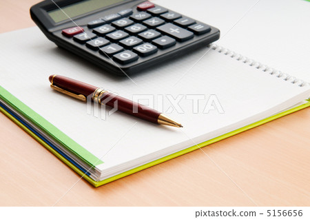 Business concept with notepad and calculator Business concept with notepad and calculator 5156656
