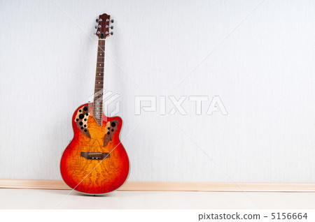 Musical concept with wooden guitar 5156664