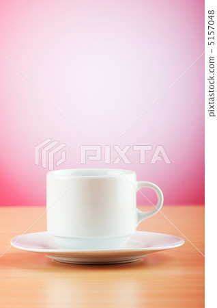 White cup against colourful gradient on the table 5157048