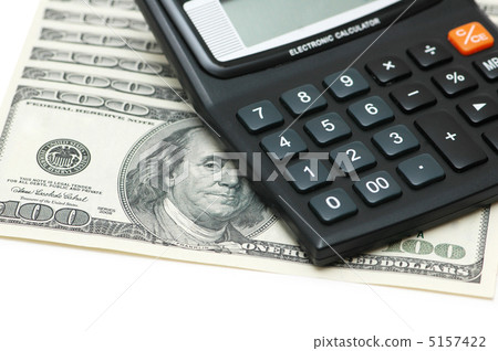 Dollars and calculators isolated on the white 5157422