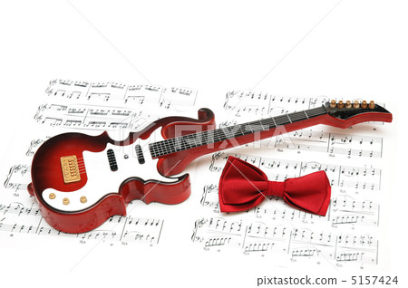 Musical notes, guitar and bow tie on white Musical notes, guitar and bow tie on white 5157424