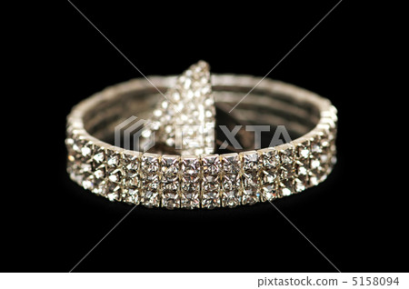 Bracelet and ring isolated on the black Bracelet and ring isolated on the black 5158094
