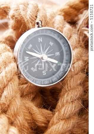 Compass and rope in travel and adventure concept Compass and rope in travel and adventure concept 5158721