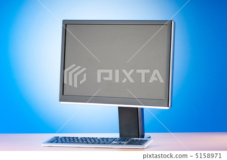 Wide screen computer monitor against colorful background Wide screen computer monitor against colorful background 5158971