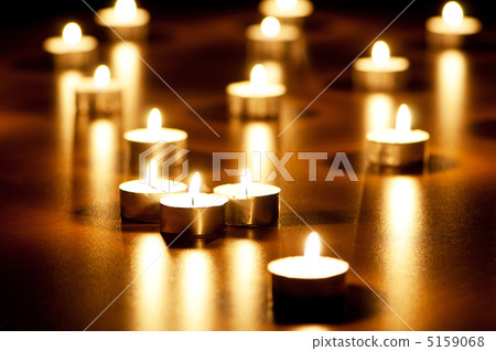 Many burning candles with shallow depth of field Many burning candles with shallow depth of field 5159068