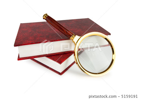 Magnifying glass over the stack of books 5159191