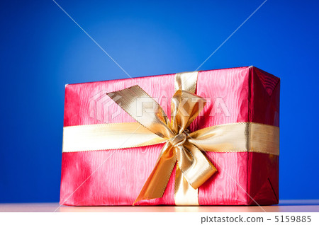 Celebration concept - Gift box against colorful background Celebration concept - Gift box against colorful background 5159885