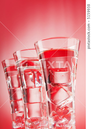 Water in the glass against gradient background Water in the glass against gradient background 5159938