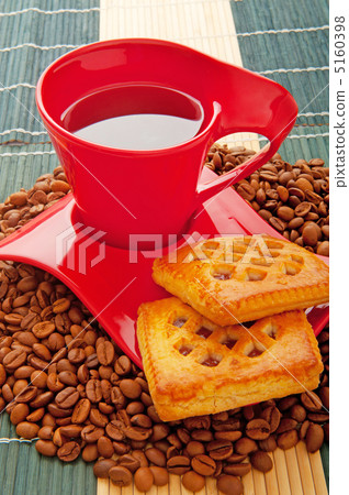 Cup of coffee with many beans around Cup of coffee with many beans around 5160398