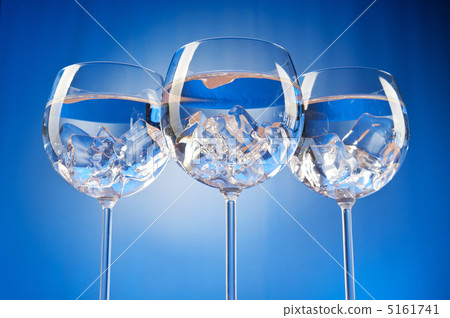 Water in the glass against gradient background 5161741