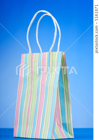 Colourful paper shopping bags against gradient background Colourful paper shopping bags against gradient background 5161871
