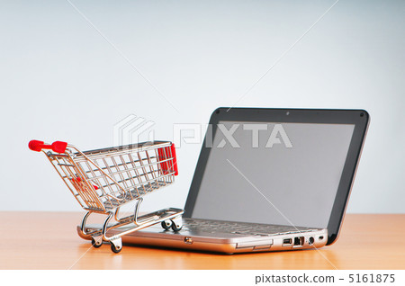 Internet online shopping concept with computer and cart Internet online shopping concept with computer and cart 5161875
