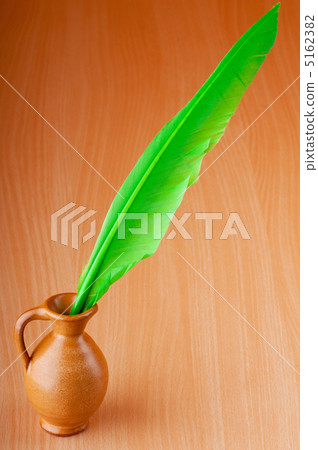 Writing feather against gradient background Writing feather against gradient background 5162382
