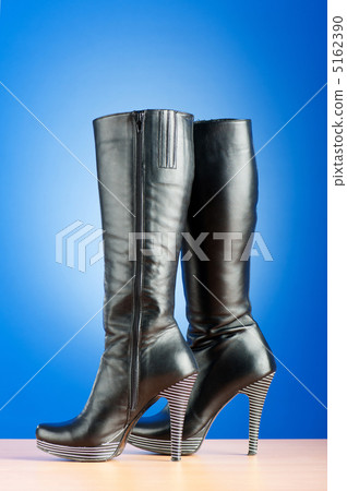 Fashion concept with woman top boots Fashion concept with woman top boots 5162390