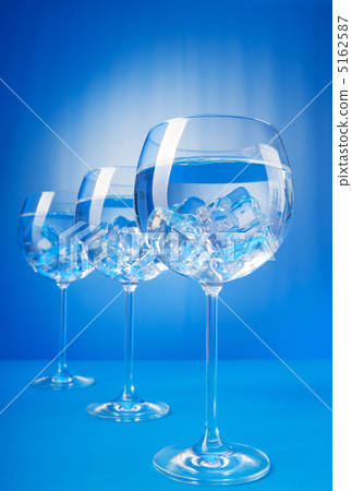 Water in the glass against gradient background Water in the glass against gradient background 5162587