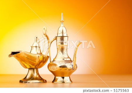 Ancient lamp against gradient background Ancient lamp against gradient background 5175563