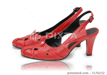 Elegant red shoes on the white 5176232