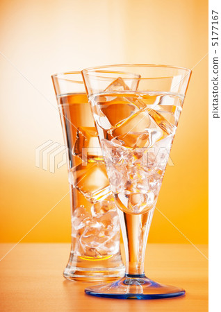 Water in the glass against gradient background 5177167