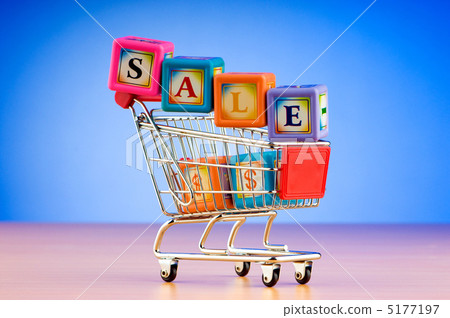 Mini shopping cart against gradient background Mini shopping cart against gradient background 5177197