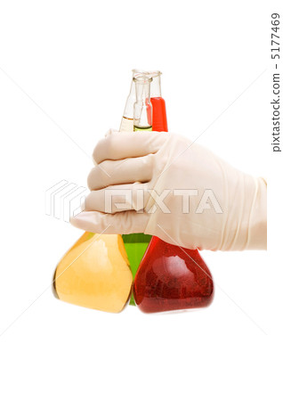 Hand holding red and green tubes isolated on white 5177469