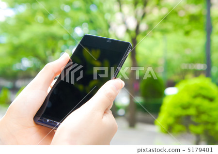 Smartphone at the park Smartphone at the park 5179401