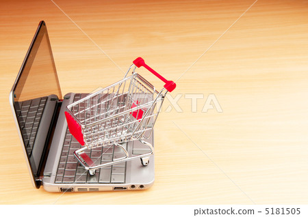 Internet online shopping concept with computer and cart 5181505