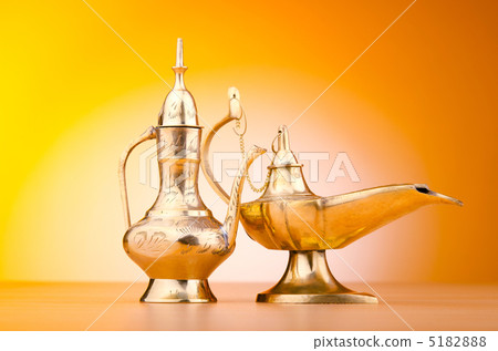 Ancient lamp against gradient background 5182888