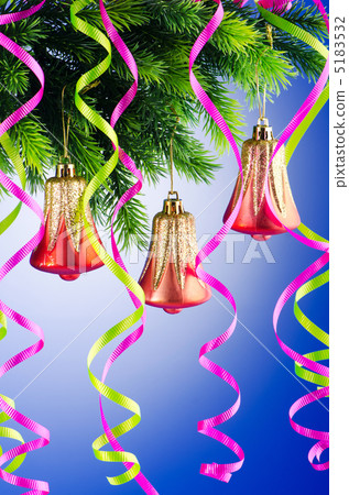 Baubles on christmas tree in celebration concept 5183532