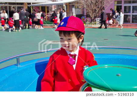 Kindergarten child playing with playground equipment 5198310