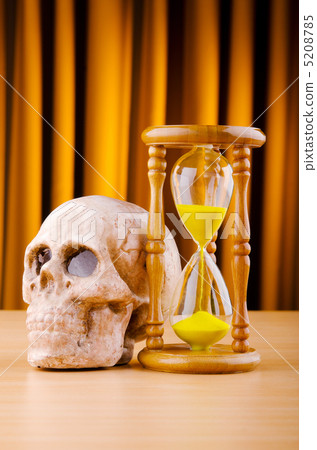 Concept of death with hourglass and skull Concept of death with hourglass and skull 5208785