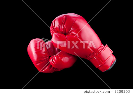 Red boxing gloves isolated on black 5209303