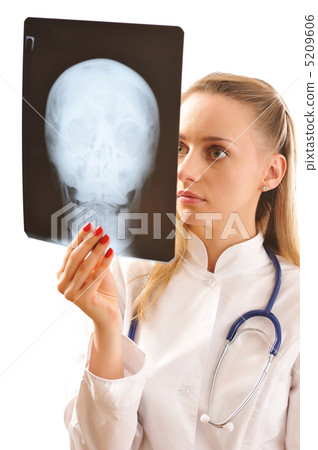 Doctor looking at x-ray Doctor looking at x-ray 5209606