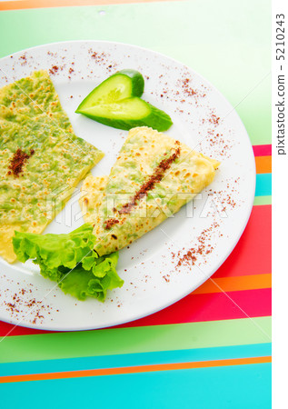 Pancake with herbs in the plate 5210243