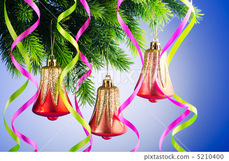 Baubles on christmas tree in celebration concept Baubles on christmas tree in celebration concept 5210400