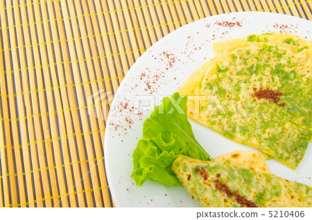 Pancake with herbs in the plate 5210406
