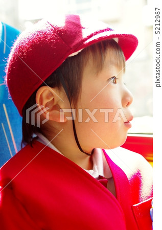 Kindergarten child riding a bus 5212987