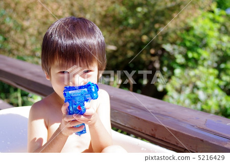 Children playing with water guns Children playing with water guns 5216429