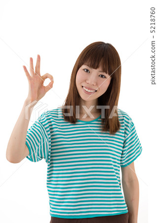 A brown woman wearing a border T shirt 5218760
