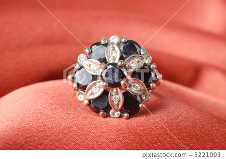 Jewellery ring on the satin background 5221003
