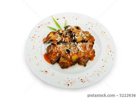 Meat under tasty sauce in plate 5222636