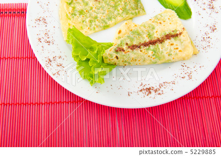 Pancake with herbs in the plate 5229885