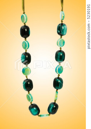Nice necklace against gradient background Nice necklace against gradient background 5230191