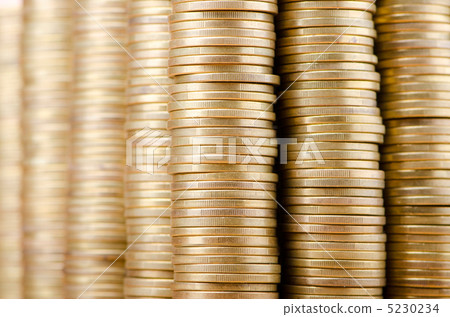 Golden coins in high stacks 5230234