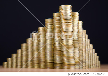 Golden coins in high stacks 5230235