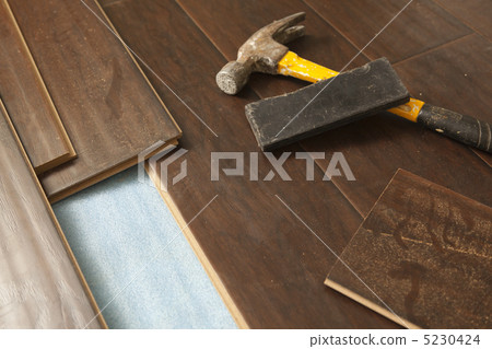 Hammer and Block with New Laminate Flooring Hammer and Block with New Laminate Flooring 5230424