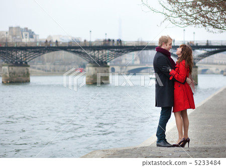 Romantic couple in love hugging near Pont des Arts in Paris 5233484