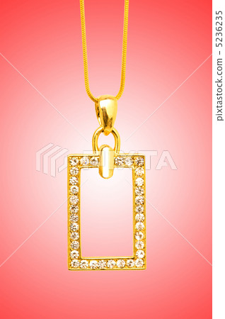 Golden jewellery against gradient background Golden jewellery against gradient background 5236235